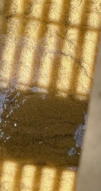 Flocculant chemical used to promote particle aggregation and solids removal in wastewater treatment